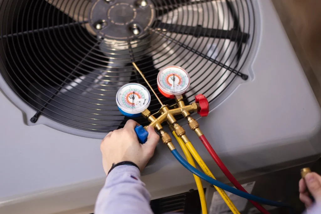 HVAC Comfort tech testing an AC unit.