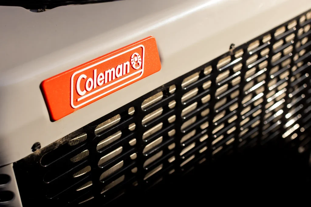 Coleman AC unit sitting in sun.